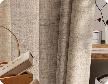 Beige linen curtains with a rustic weave partially frame the view.
